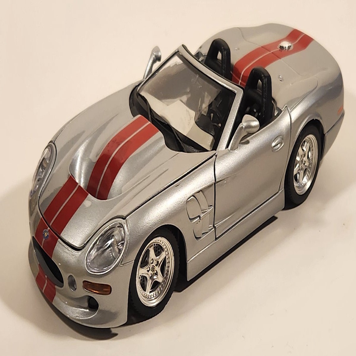 Burago 1999 Shelby Series 1 Silver with Red Stripes 1/18 Scale Die Cast Toy Car Vehicle with Opening Doors Hood