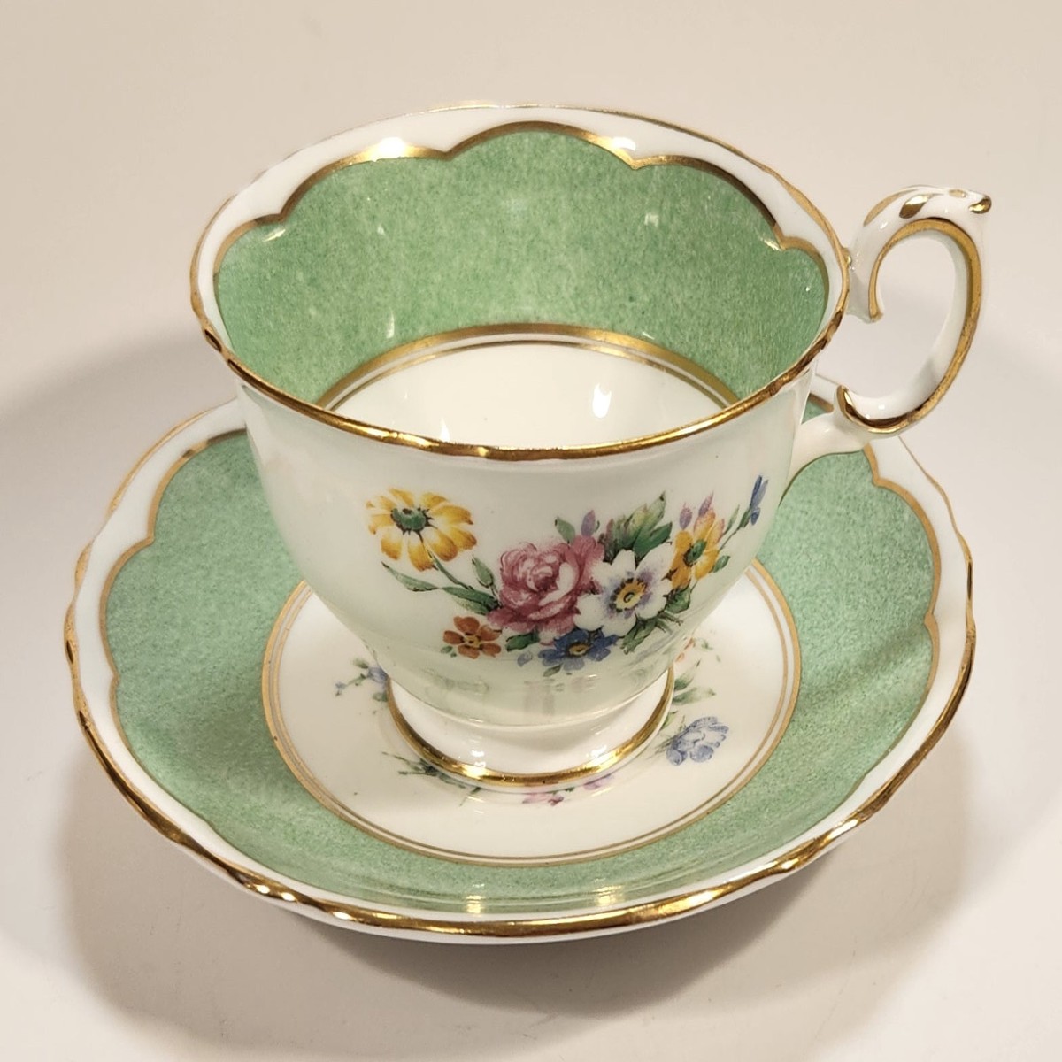 Vintage Crown Fine Bone China Staffordshire England Mixed Flower Pattern Green and White Gold Trim Tea Cup Saucer